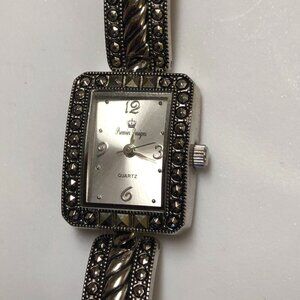 Stylish silver color watch with bracelet.
